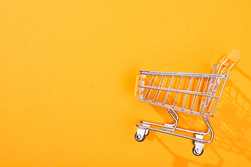 Top view of an empty shopping cart depicting abandonment cart email concept