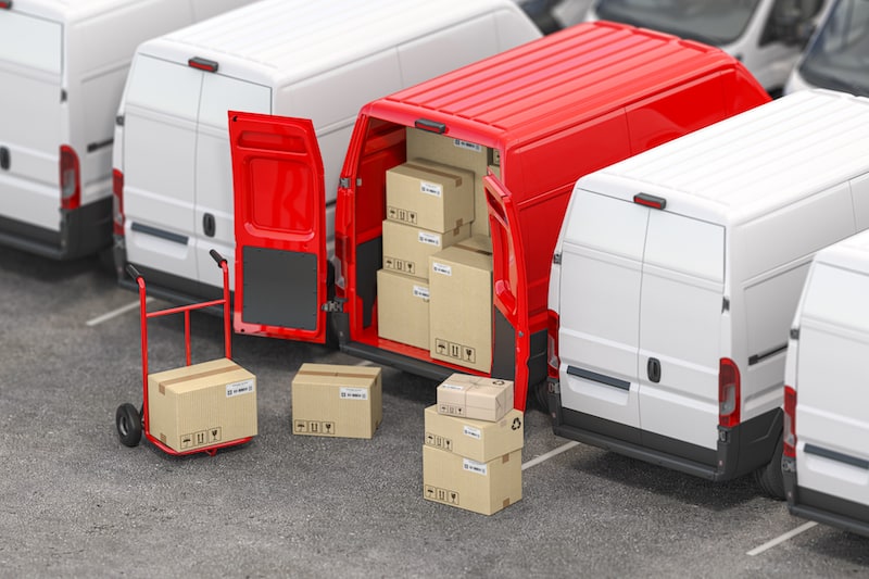 Cheapest overnight shipping concept red delivery van surrounded by white vans
