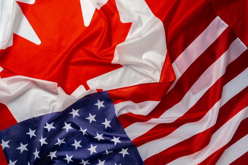 Folded Canada flag USA flag cross border shipping concept
