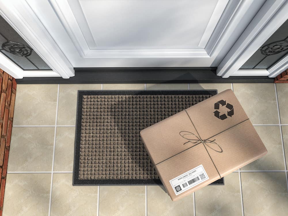cheapest shipping options Canada concept photo parcel package on door step