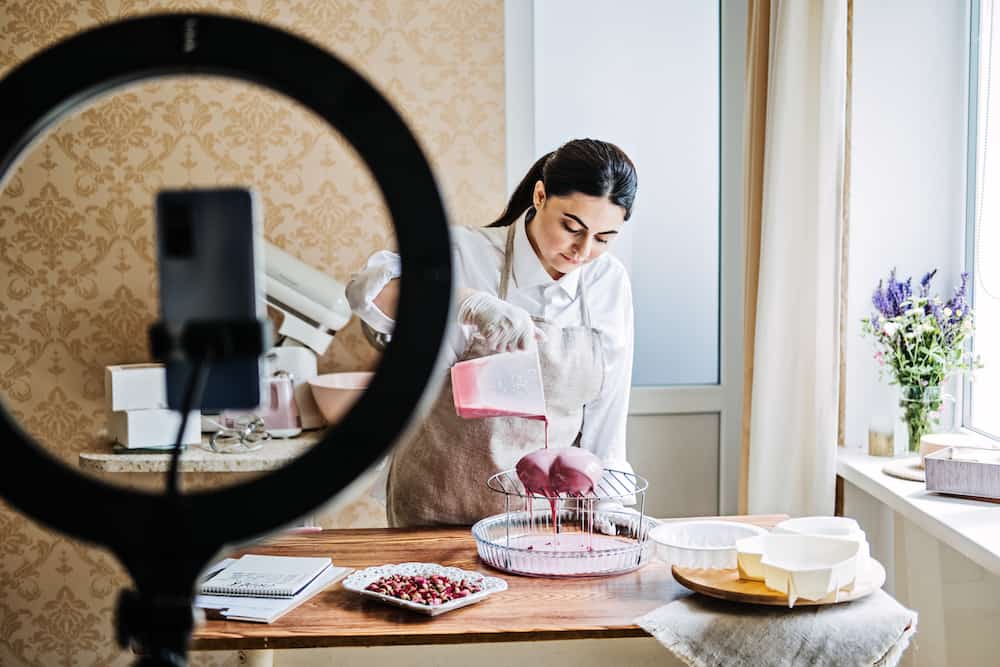 Woman recording a digital product baking class