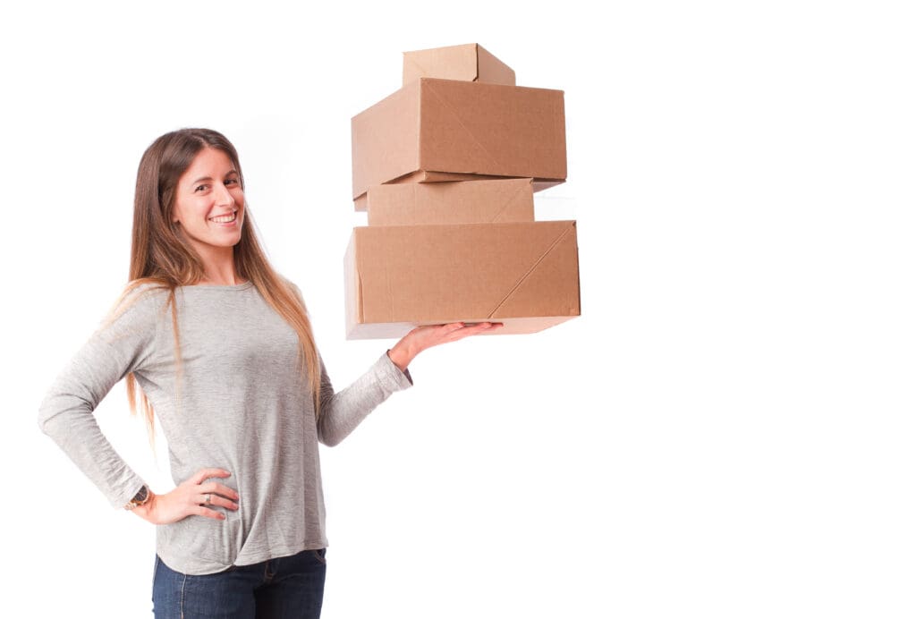 A woman holding a shipping boxes