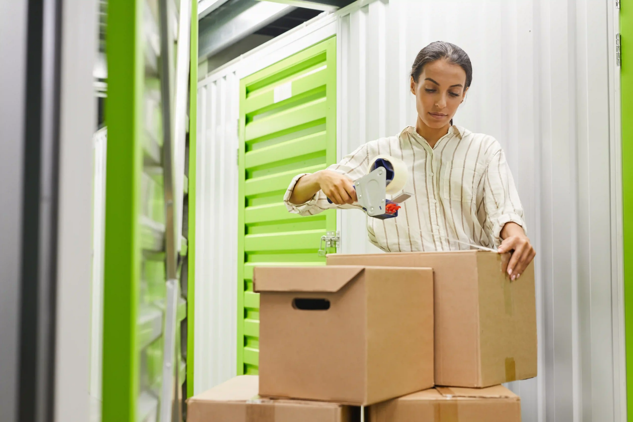 A girl packing shipping items. shipping insurance for black friday